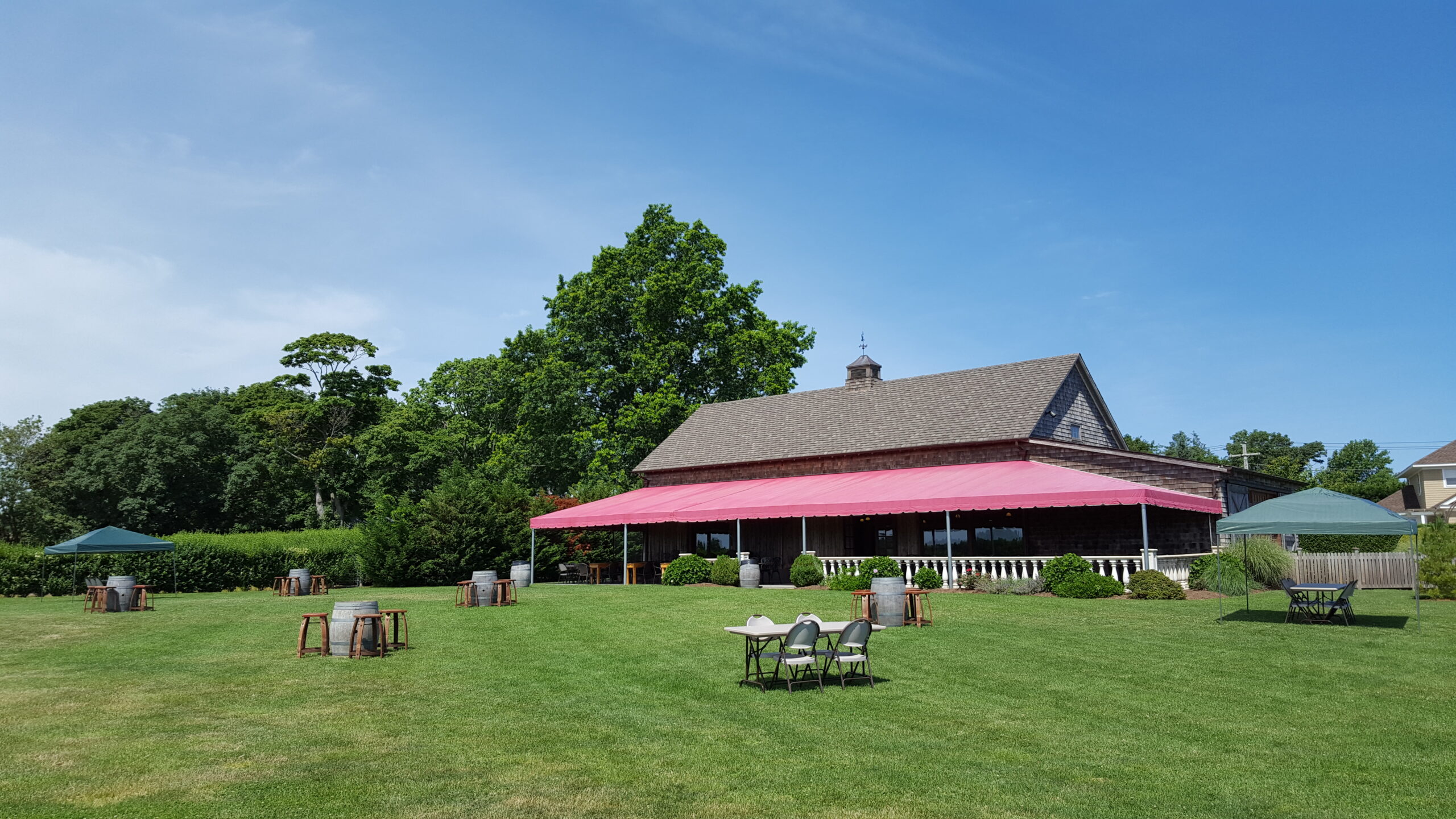 Clovis Point tasting room, covered terrace and lawn in Jamesport